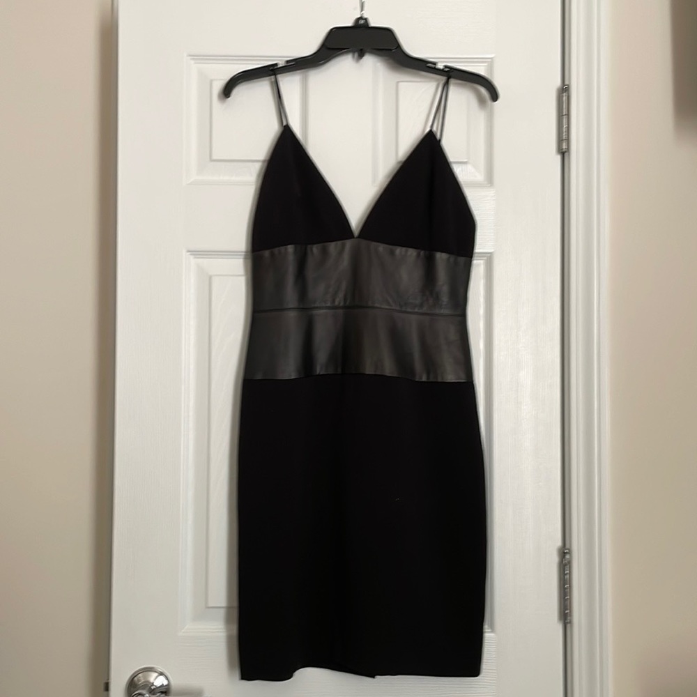 Black, spaghetti strap dress with lamb skin trim